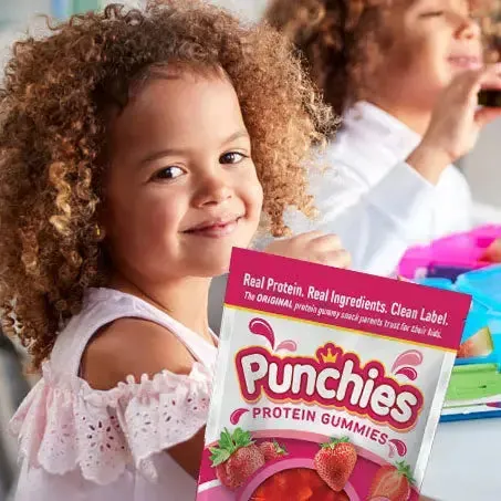 Kids protein gummy: a smiling girl with a bag of Punchies protein gummies